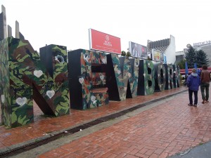 Two monuments honoring Kosovo's international allies. The Newborn sign is painted with a new design every year. This year, it bears the military camo of the countries that participated in NATO's "liberation" of Kosovo. 